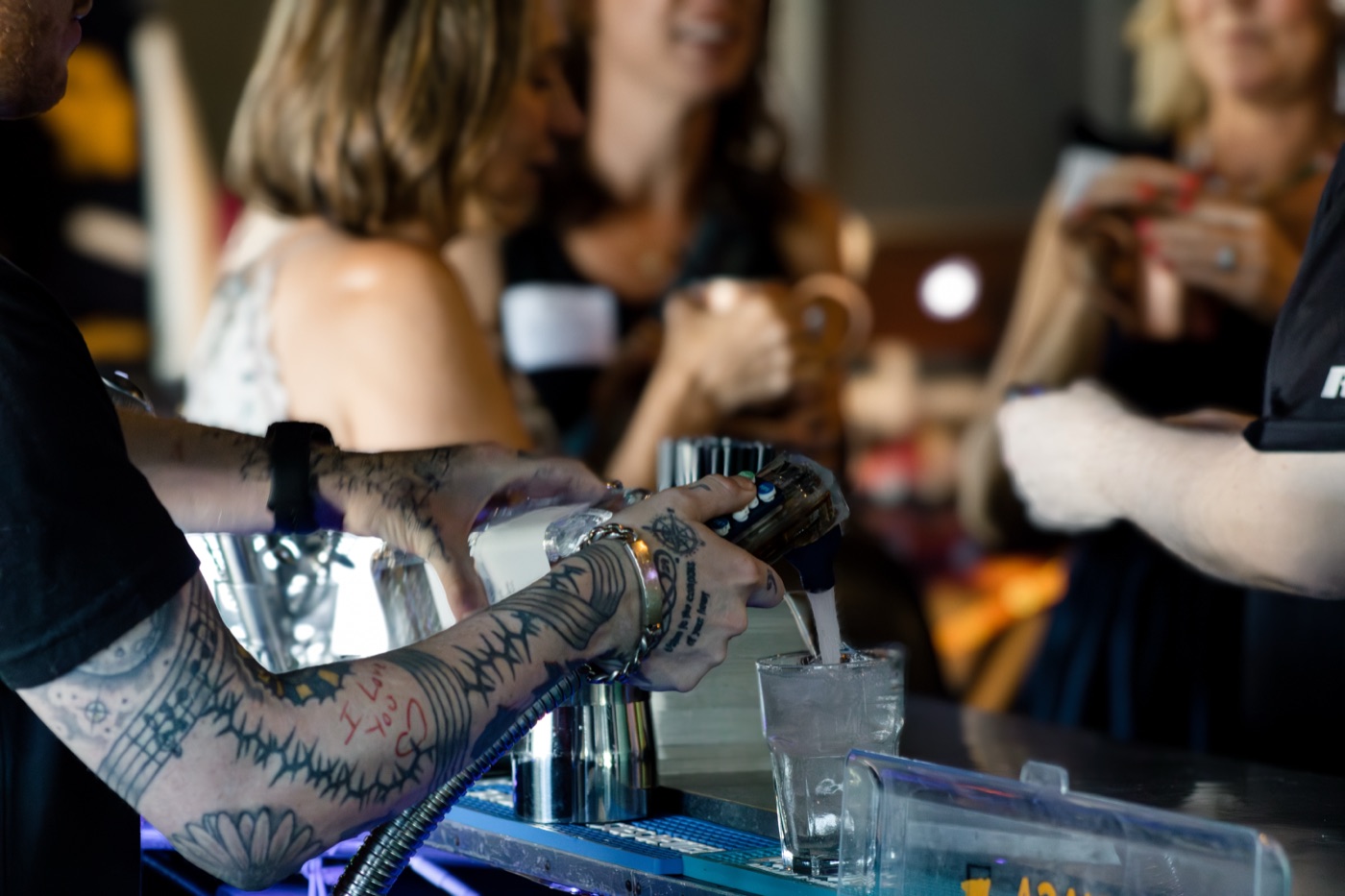 Bartender pouring drinks