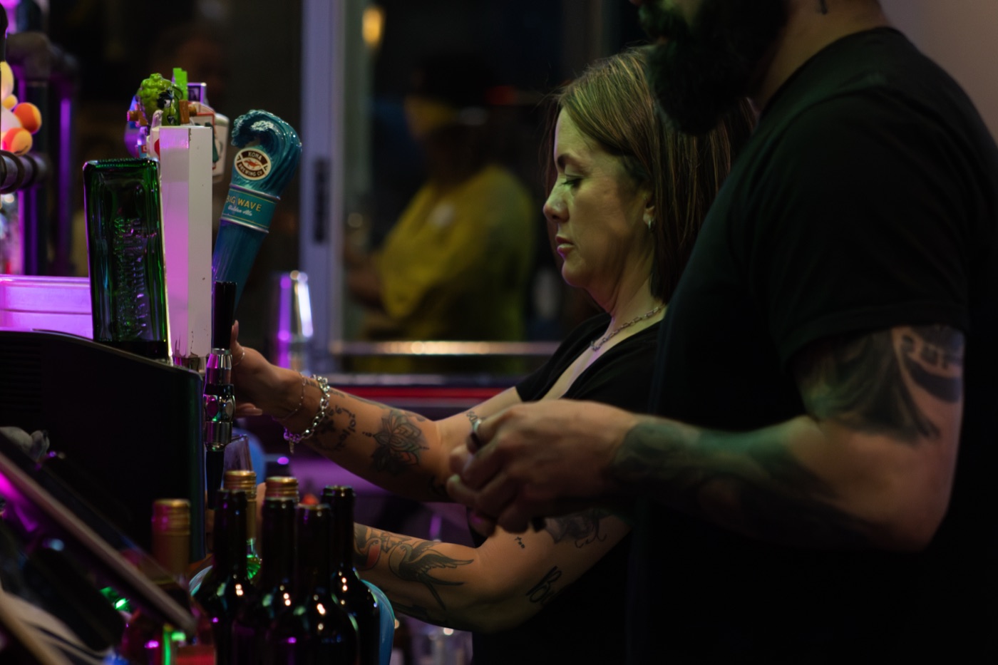 Bartender working the tap