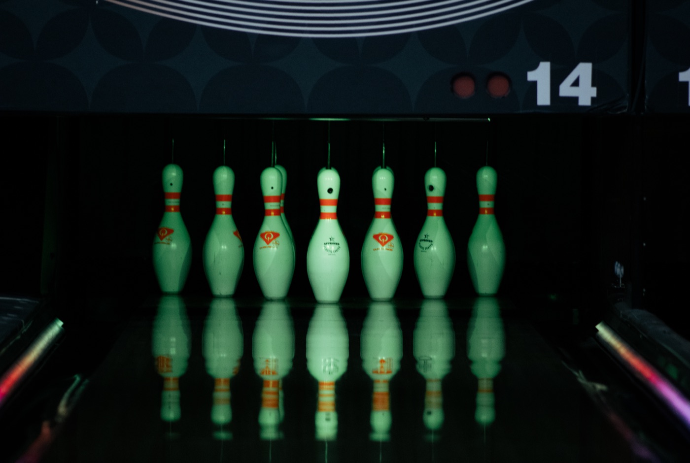 Glowing neon bowling pins